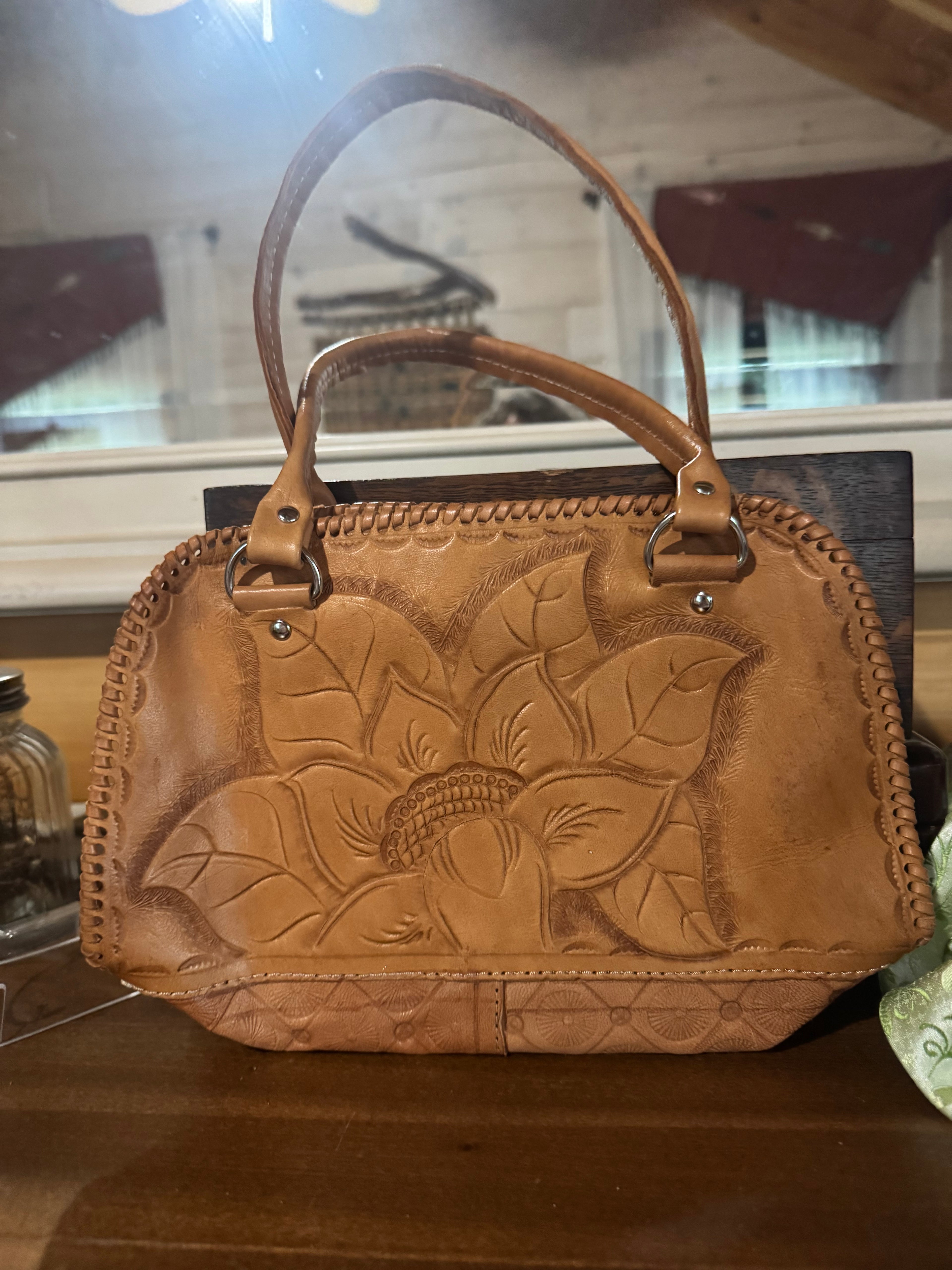 Hand tooled small leather handbag