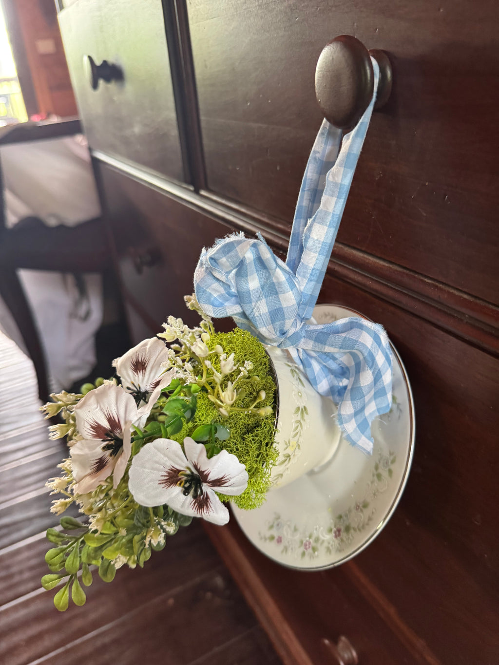 Hanging teacup flower arrangement